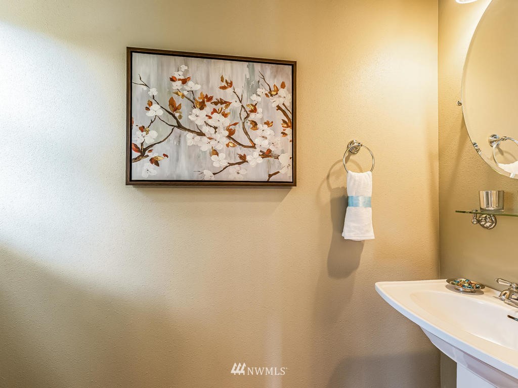 2019 Northeast 9th Court, Unit A Renton, WA 98056 - Photo 11 of 26 a bathroom with a sink and a mirror