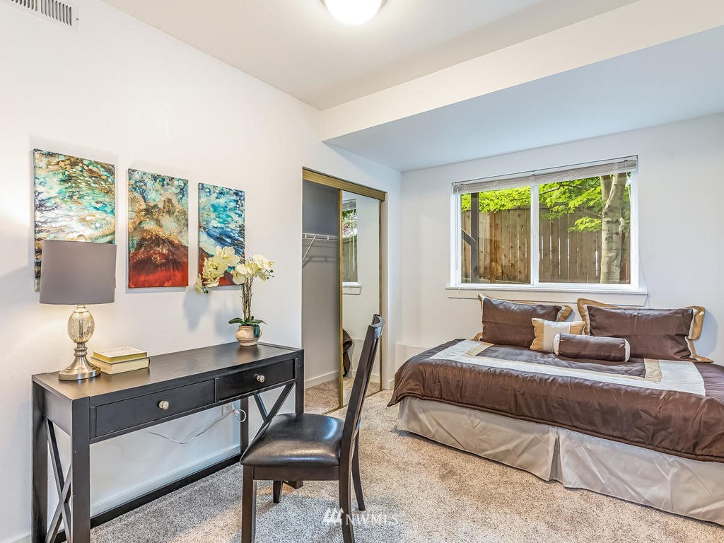 2019 Northeast 9th Court, Unit A Renton, WA 98056 - Photo 19 of 26 a living room with furniture and a flat screen tv