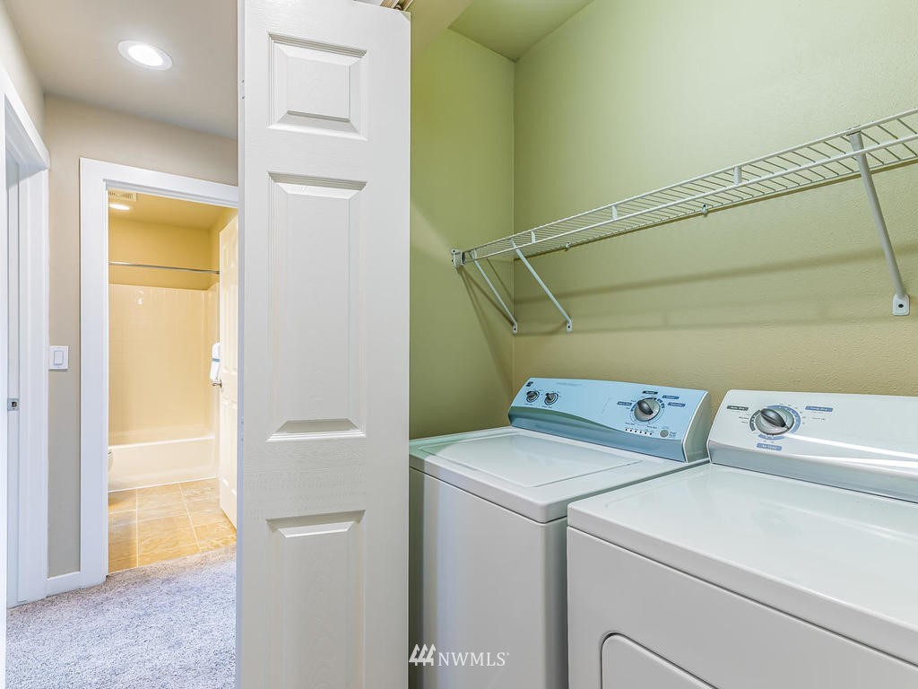 2019 Northeast 9th Court, Unit A Renton, WA 98056 - Photo 20 of 26 a utility room with dryer and washer