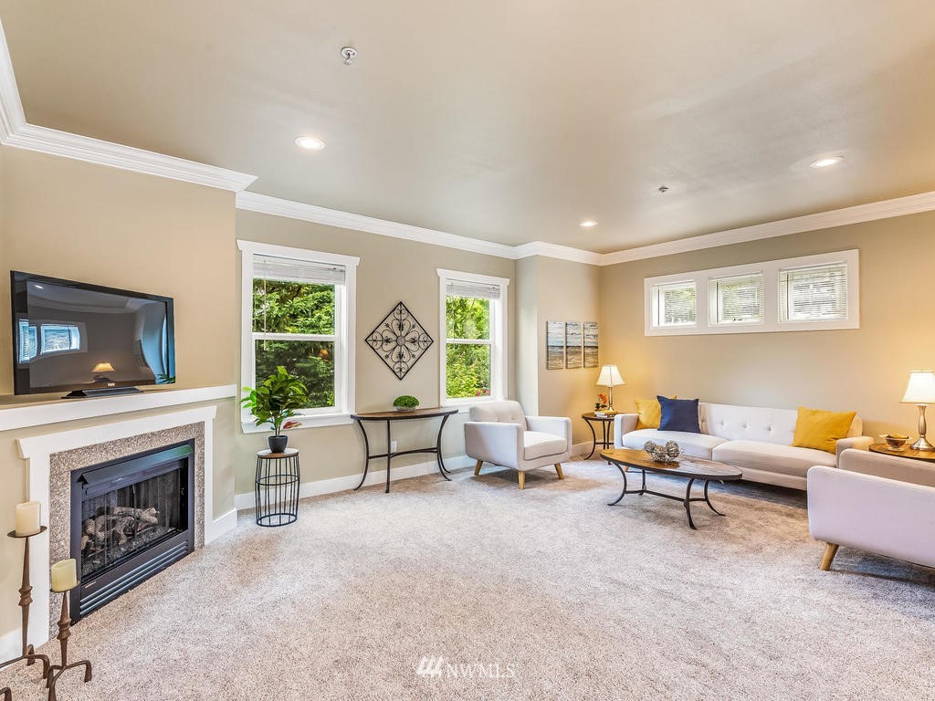 2019 Northeast 9th Court, Unit A Renton, WA 98056 - Photo 4 of 26 a living room with furniture and a fireplace