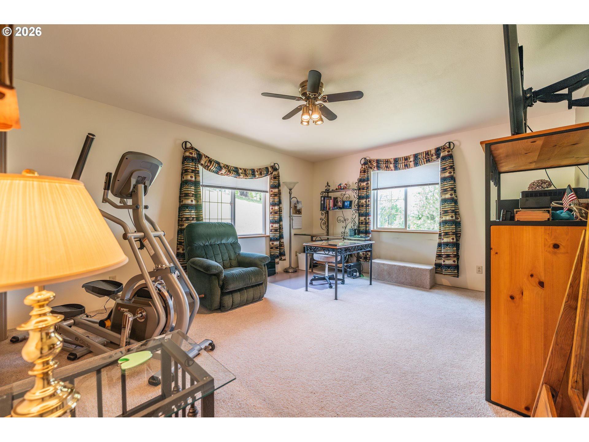 489 Fir Vista Road Sutherlin, OR 97479 - Photo 22 of 47 a living room with furniture a flat screen tv and a window