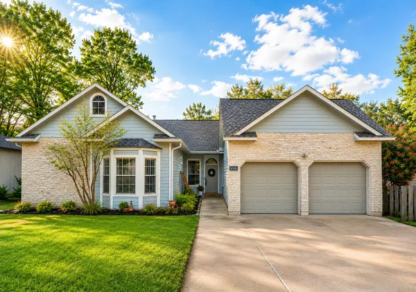 a front view of a house with garden