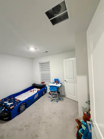 a bathroom with a double vanity sink mirror and toilet