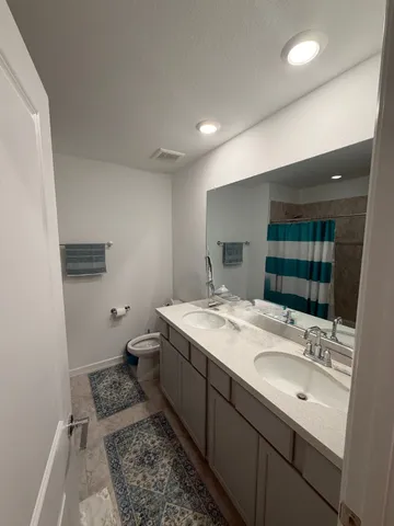 a bedroom with a bed and a couch