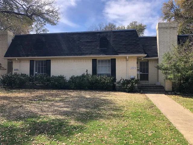 a house view with a garden space