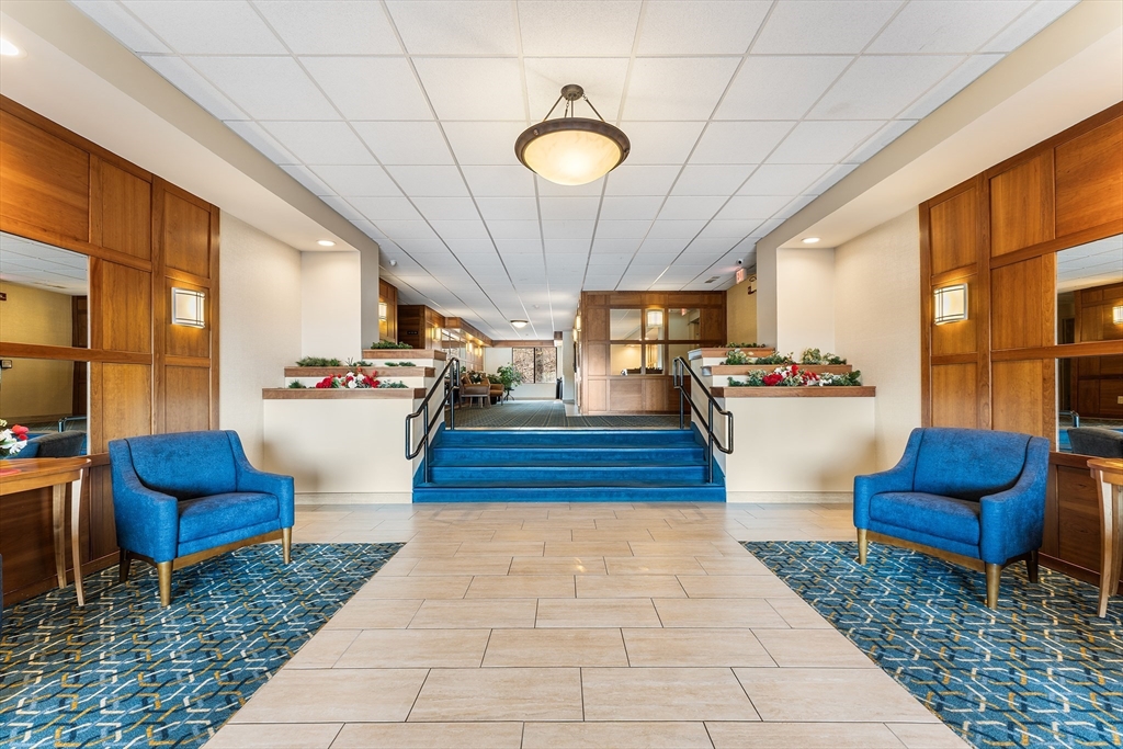1500 Worcester Road, Unit 830 Framingham, MA 01702 - Photo 21 of 23 a lobby with furniture and rug