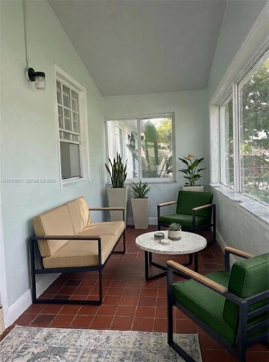 2412 Southwest 11th Street, Unit 1 Miami, FL 33135 - Photo 11 of 12 a living room with furniture and a window