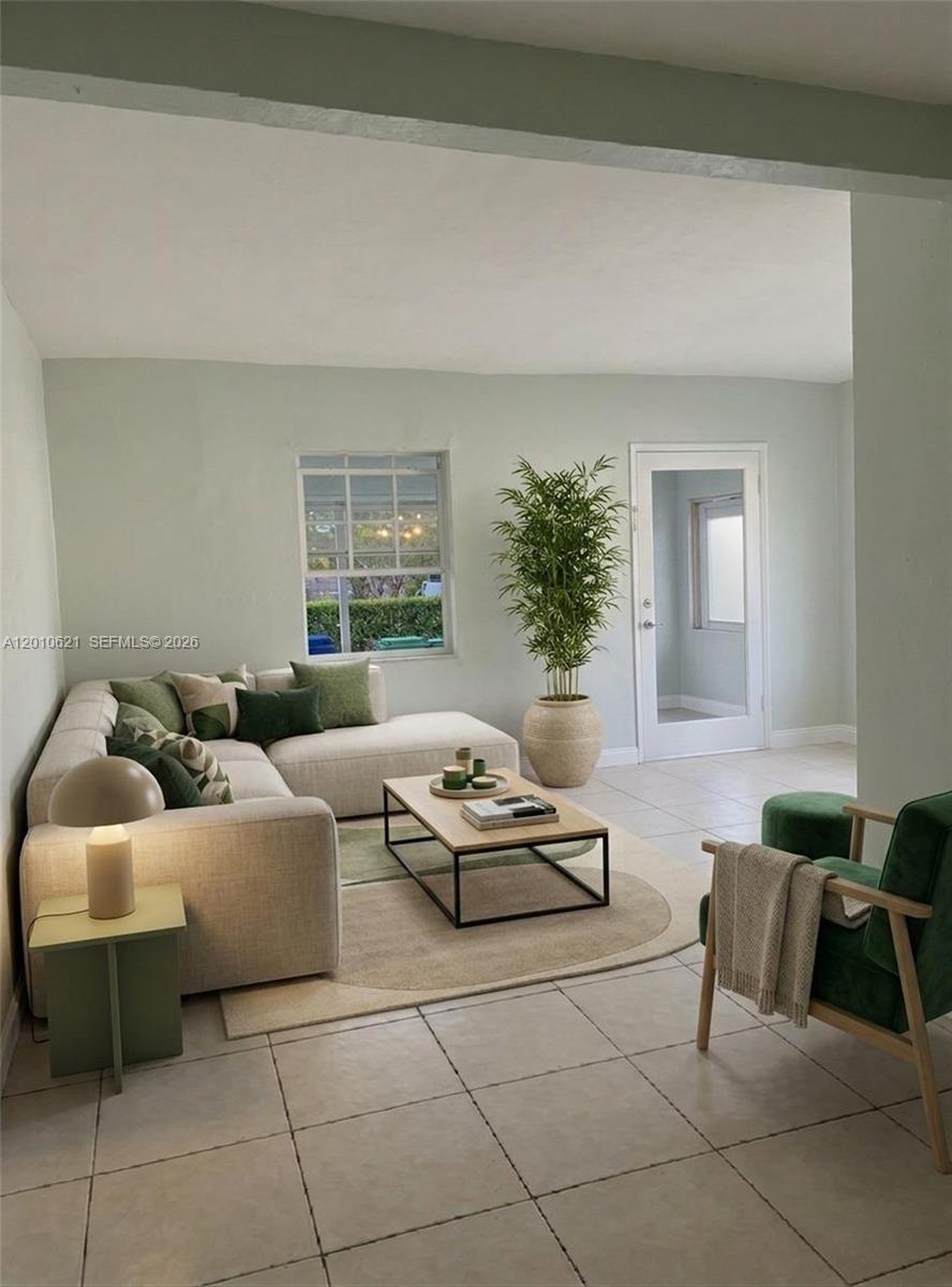2412 Southwest 11th Street, Unit 1 Miami, FL 33135 - Photo 2 of 12 a living room with furniture and a potted plant