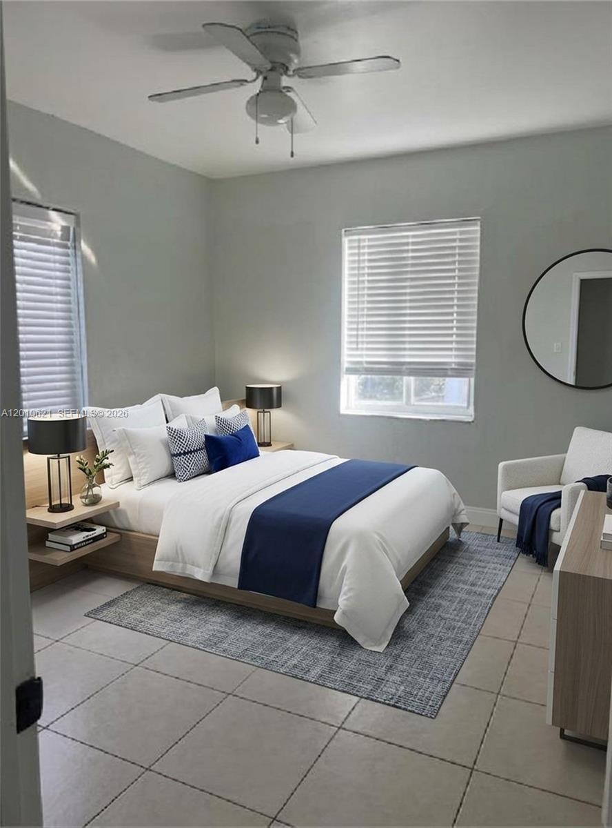 2412 Southwest 11th Street, Unit 1 Miami, FL 33135 - Photo 7 of 12 a spacious bedroom with a bed and window