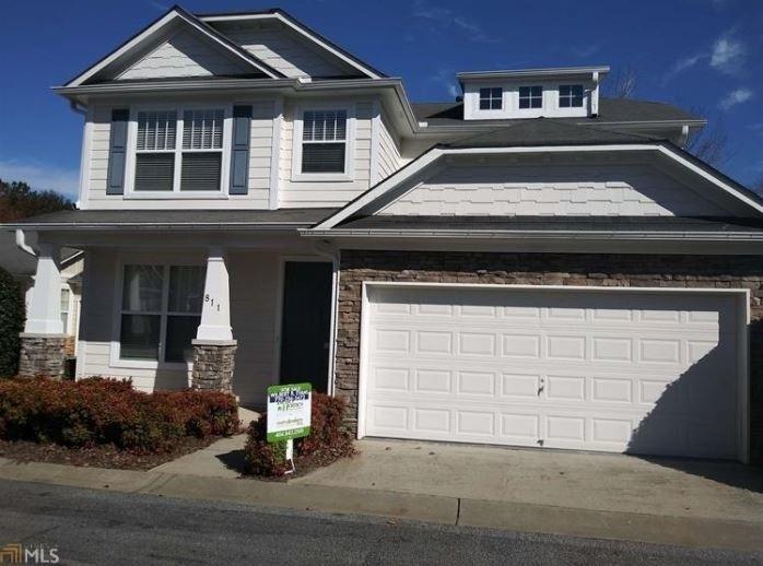 a front view of a house with a garage