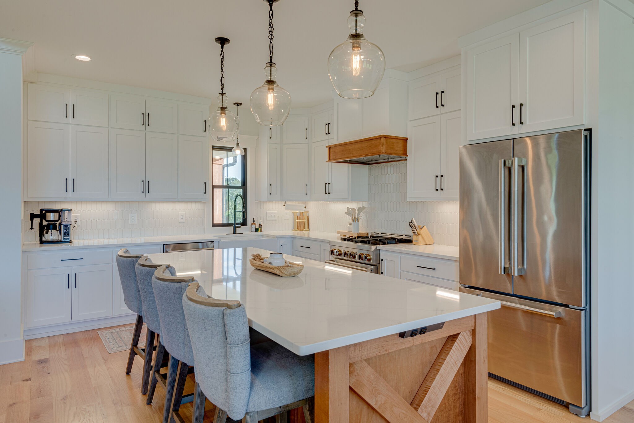 1386 Eno Road Dickson, TN 37055 - Photo 20 of 59 a kitchen with stainless steel appliances a refrigerator a stove a sink a dining table and chairs