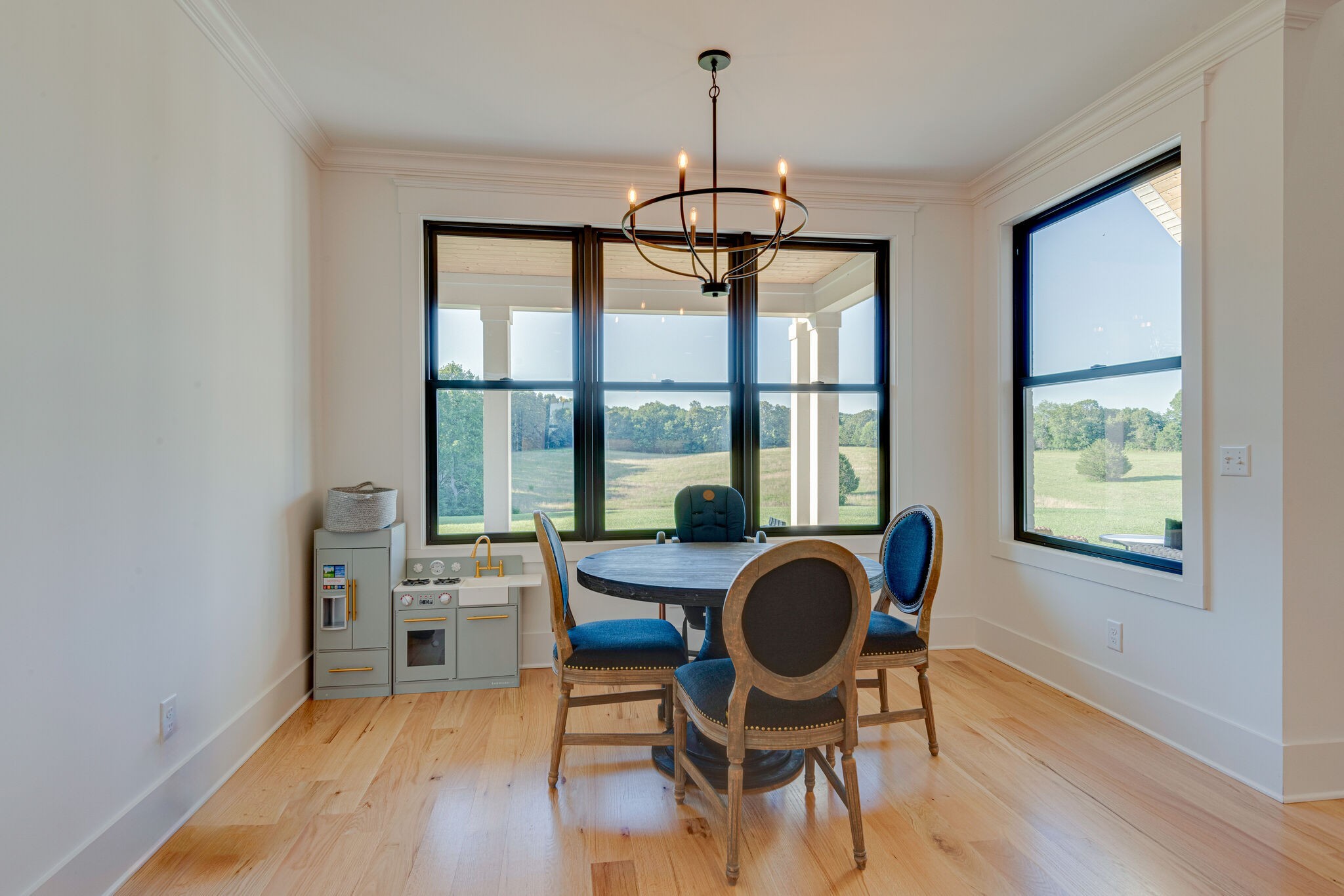 1386 Eno Road Dickson, TN 37055 - Photo 21 of 59 a view of a dining room with furniture window and wooden floor