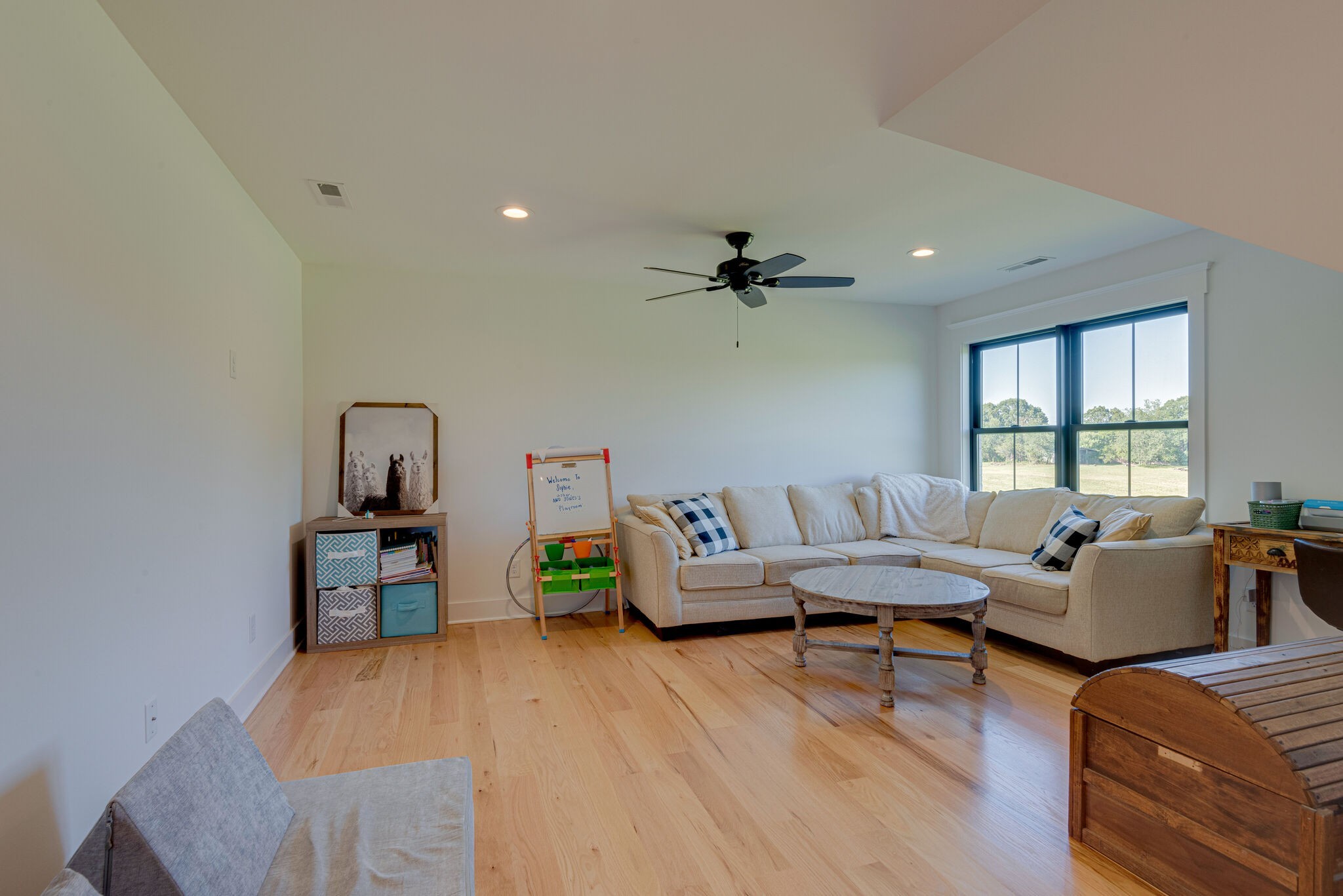 1386 Eno Road Dickson, TN 37055 - Photo 33 of 59 a living room with furniture and a wooden floor