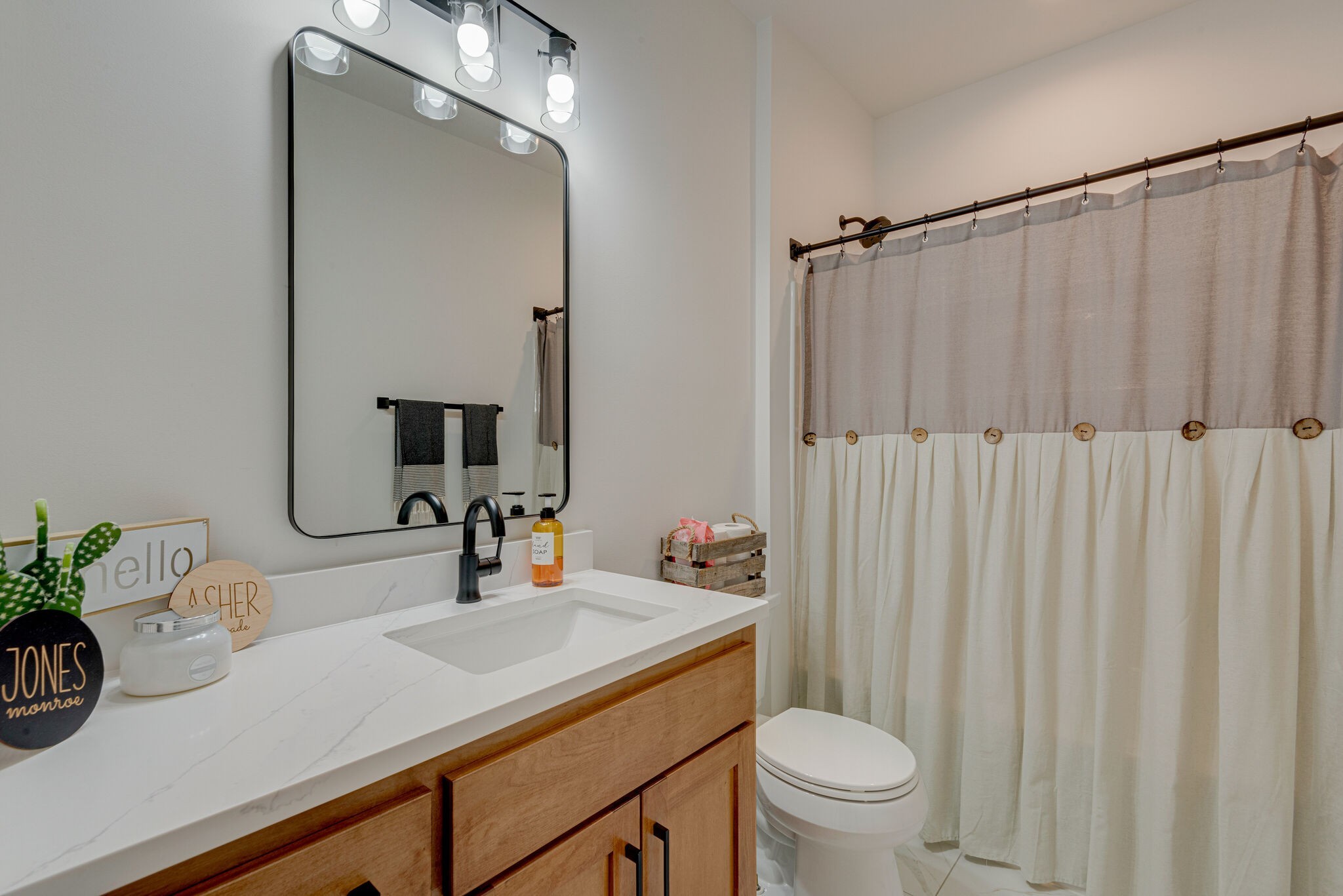 1386 Eno Road Dickson, TN 37055 - Photo 36 of 59 a bathroom with a sink a toilet and shower curtain