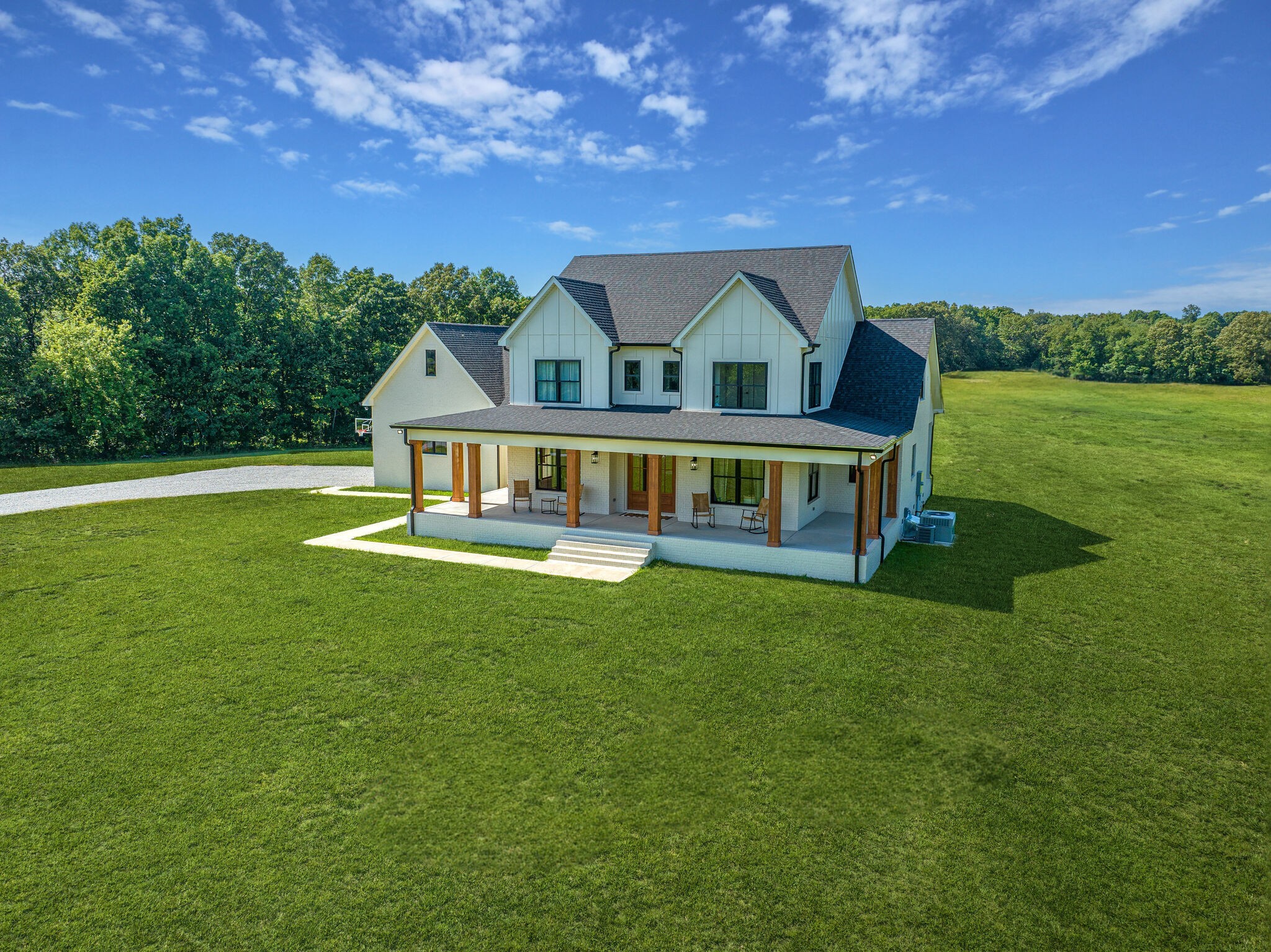 1386 Eno Road Dickson, TN 37055 - Photo 41 of 59 a front view of a house with garden