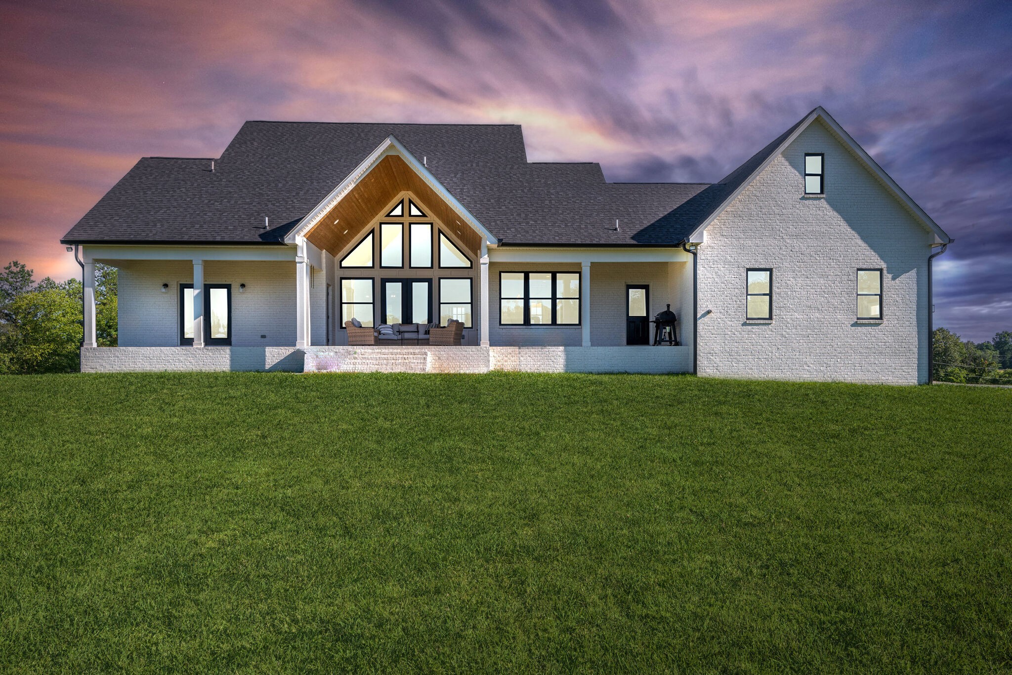 1386 Eno Road Dickson, TN 37055 - Photo 58 of 59 a front view of a house with a yard and potted plants