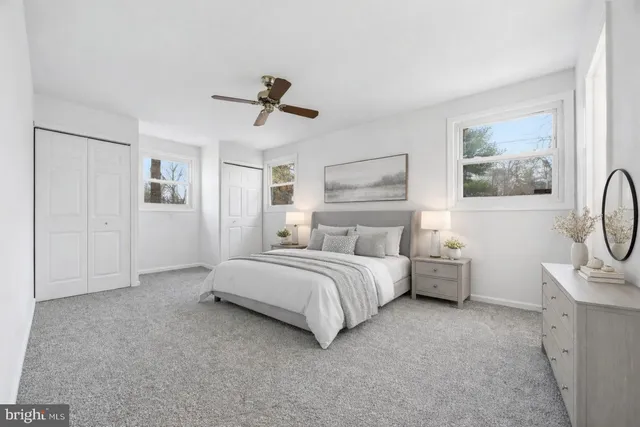 a bed room with a bed and a night stand