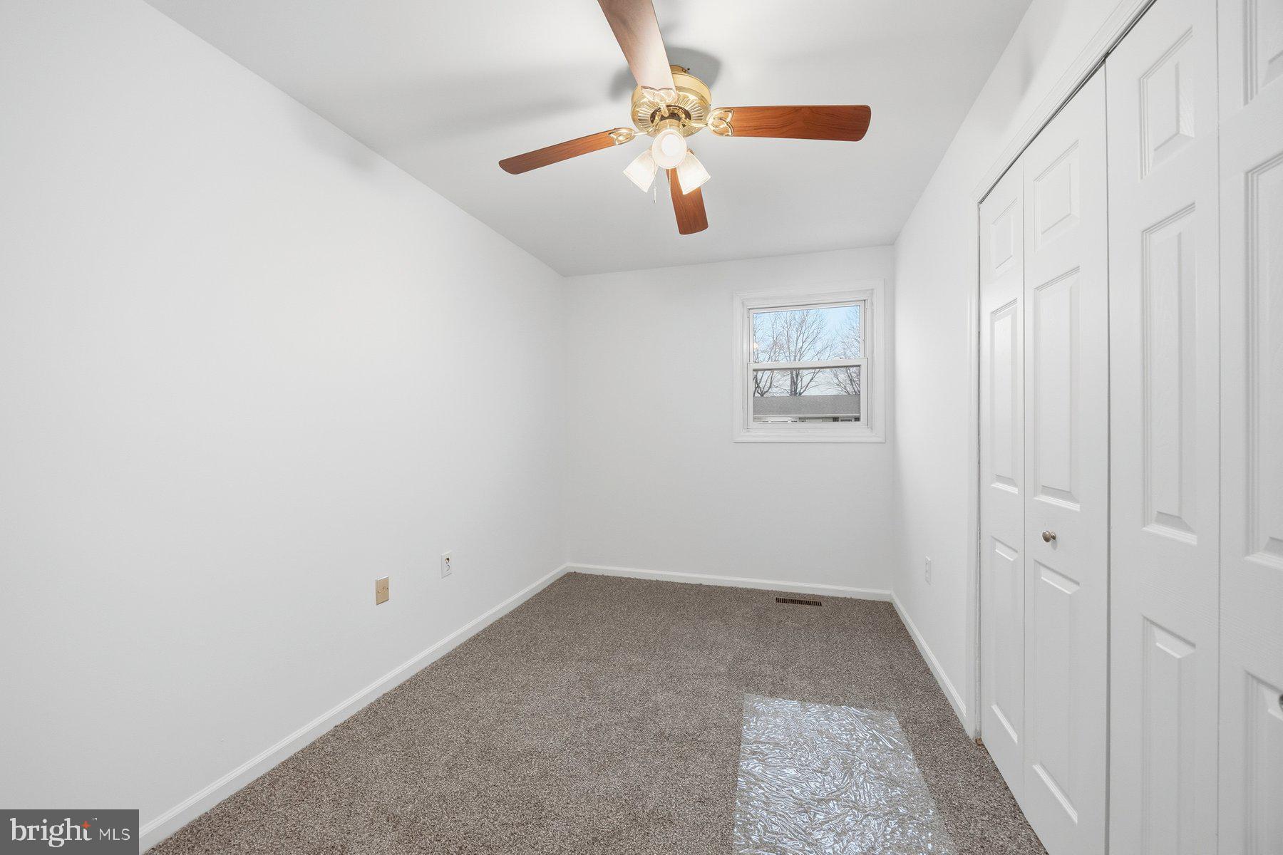 341 Dameron Street South Laurel, MD 20724 - Photo 16 of 32 wooden floor in an empty room with a window