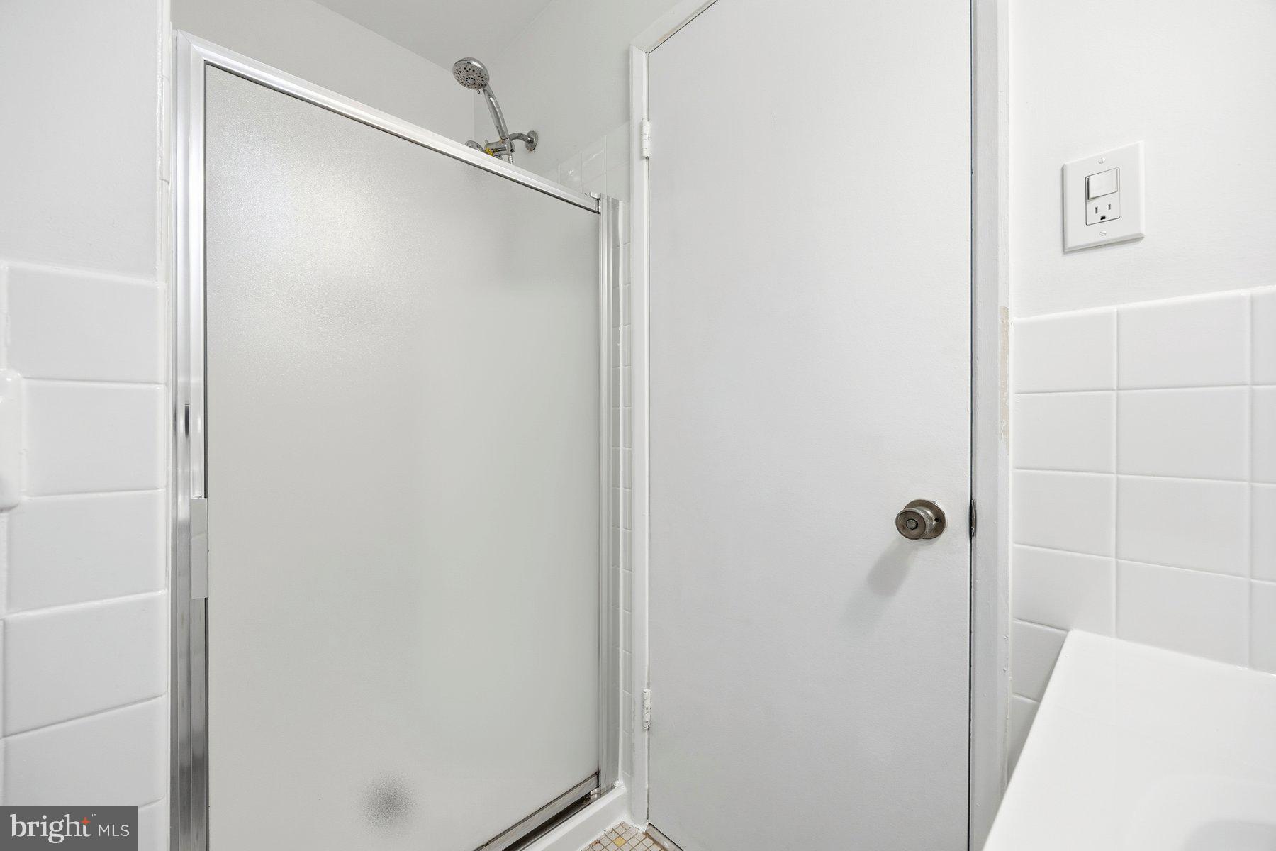 341 Dameron Street South Laurel, MD 20724 - Photo 20 of 32 a bathroom with a shower and a mirror