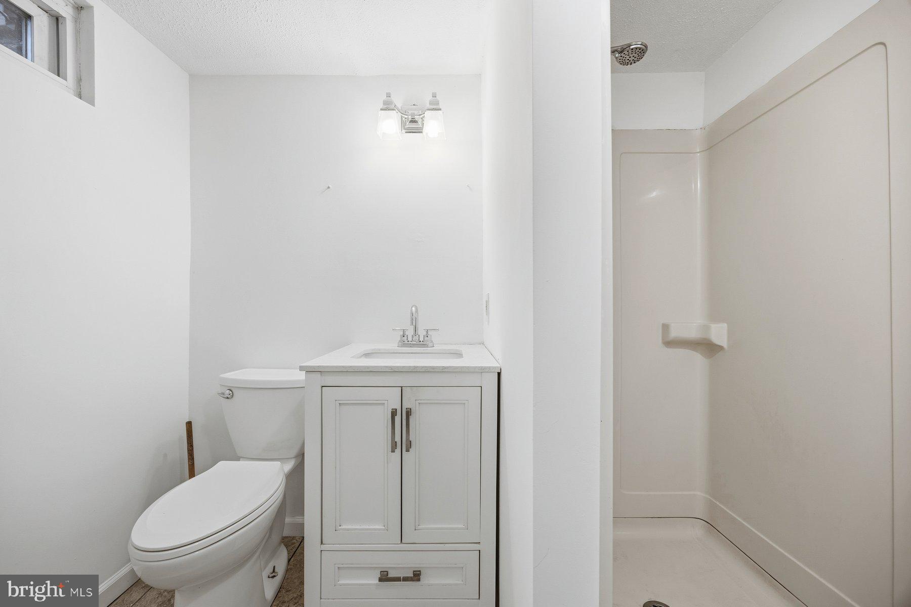 341 Dameron Street South Laurel, MD 20724 - Photo 25 of 32 a bathroom with a toilet a sink and shower