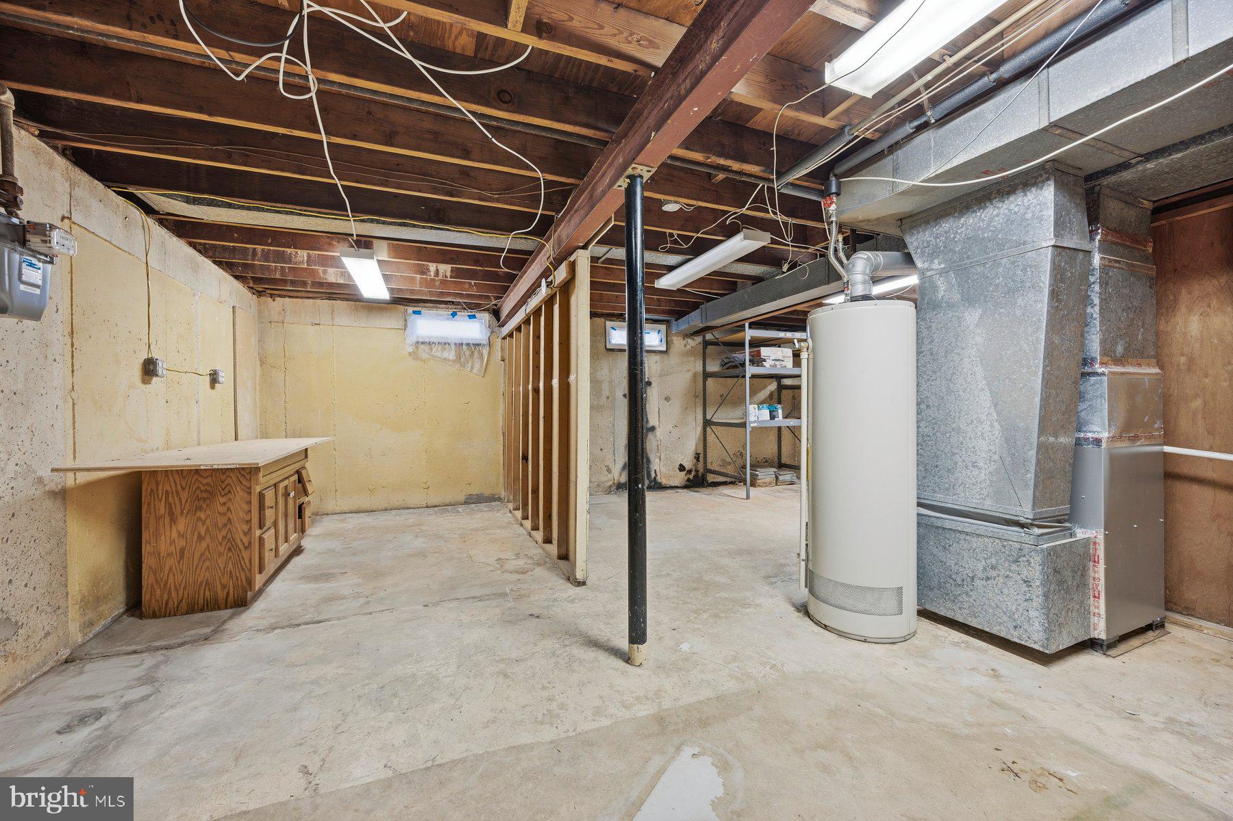 341 Dameron Street South Laurel, MD 20724 - Photo 27 of 32 a view of water heater room with refrigerator