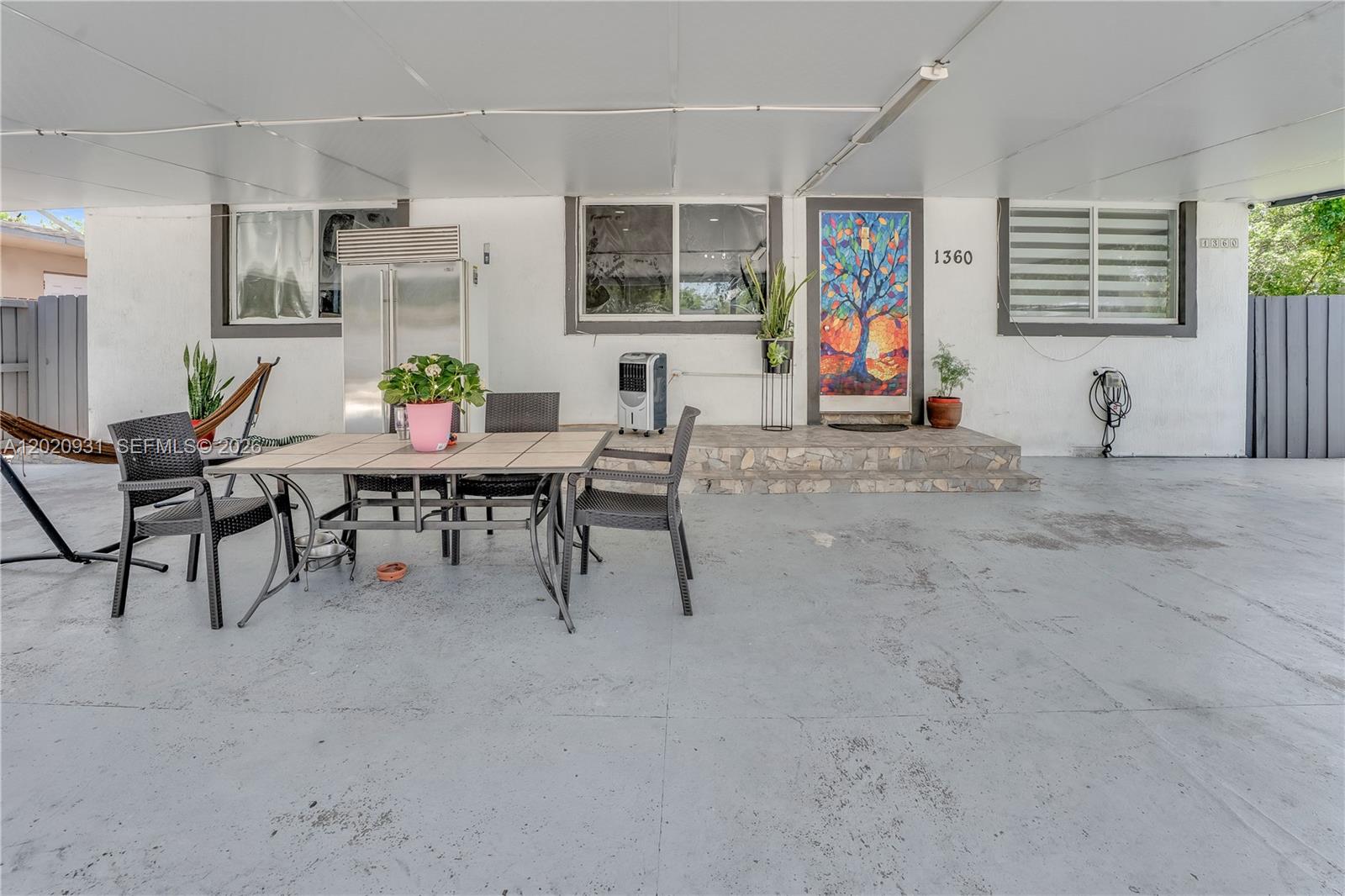 1360 Northwest 77th Street Miami, FL 33147 - Photo 4 of 41 a view of a dining room with furniture window and outside view