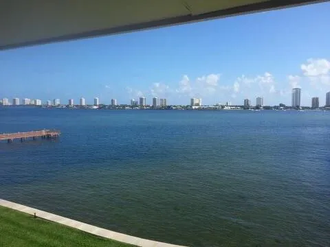 a kitchen with stainless steel appliances granite countertop a refrigerator and a stove
