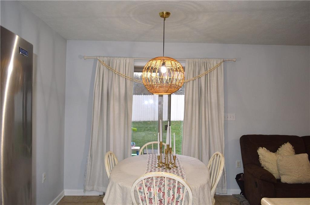 106 Meadowview Drive Renfrew, PA 16053 - Photo 7 of 17 a view of a dining room with furniture window and outside view