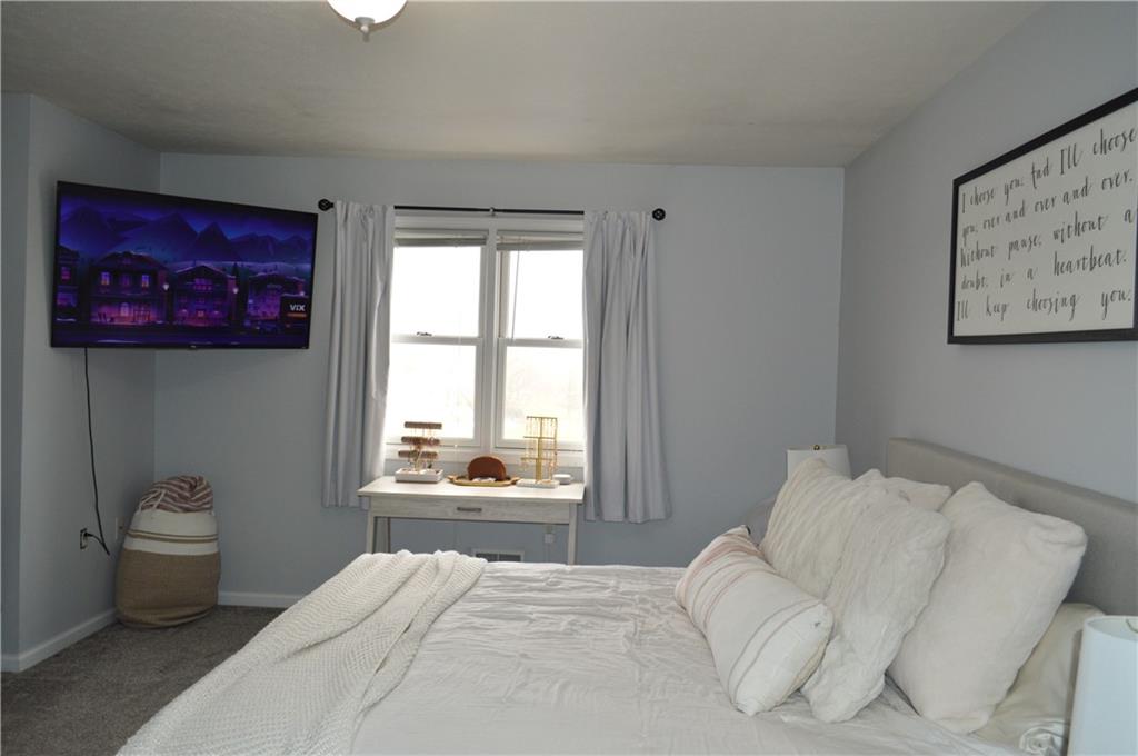 106 Meadowview Drive Renfrew, PA 16053 - Photo 9 of 17 a bedroom with a bed and a window