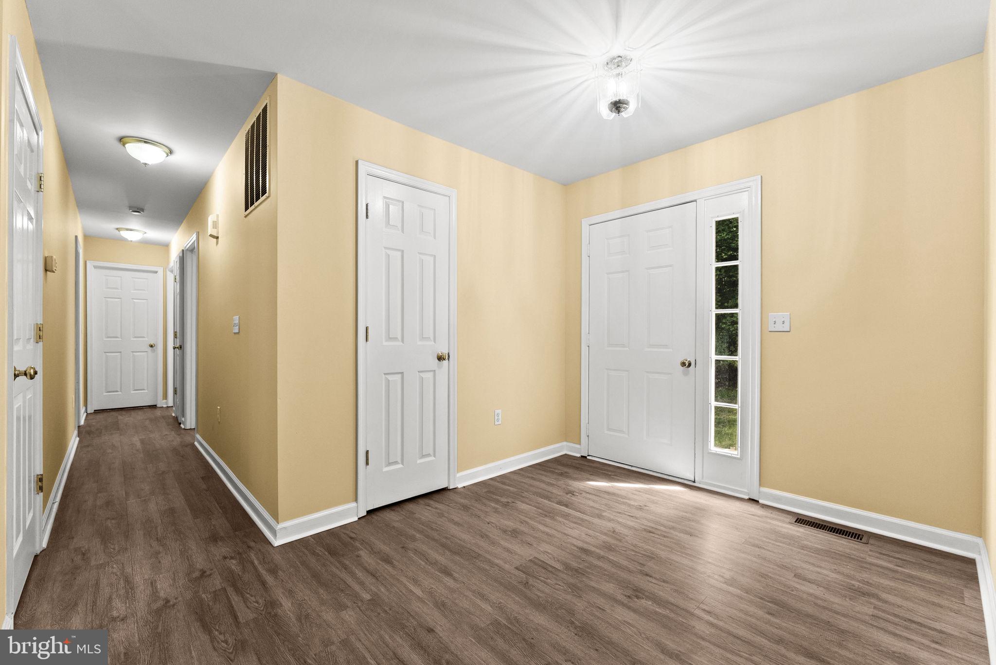 20065 Crooked Run Road Culpeper, VA 22701 - Photo 7 of 62 a view of a hallway with wooden floor