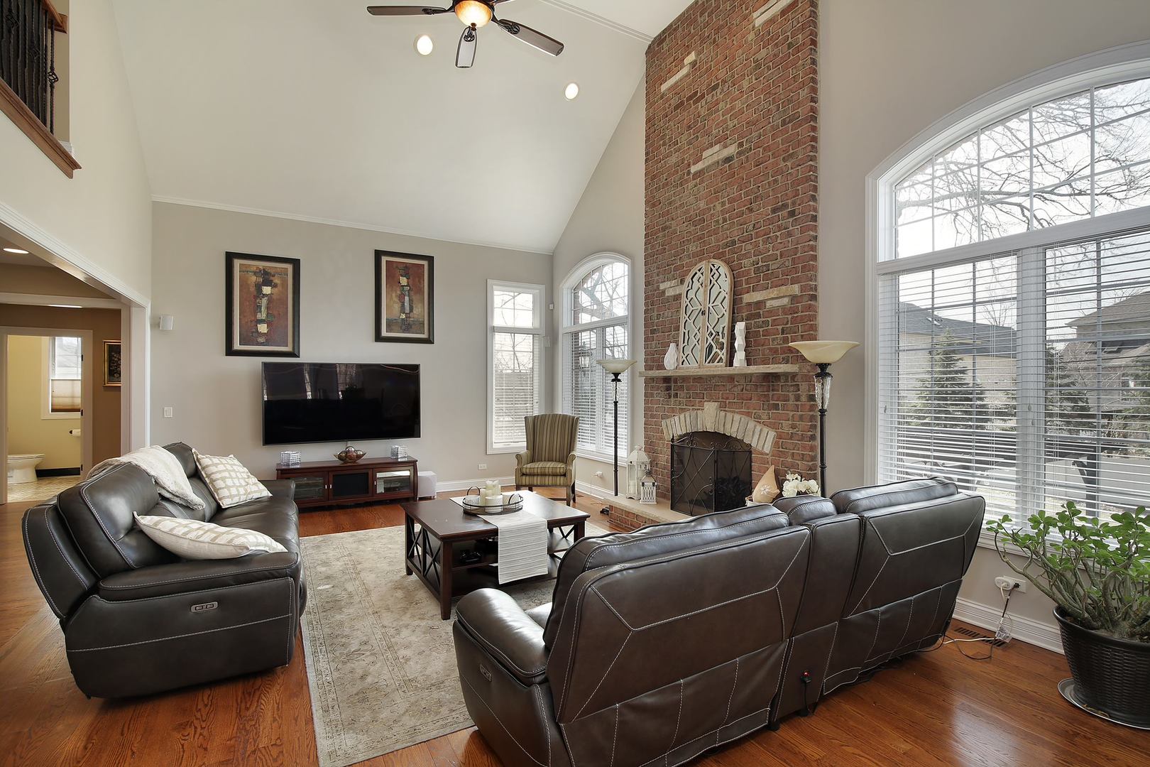 608 Revere Road Glenview, IL 60025 - Photo 6 of 34 a living room with furniture a flat screen tv and a fireplace