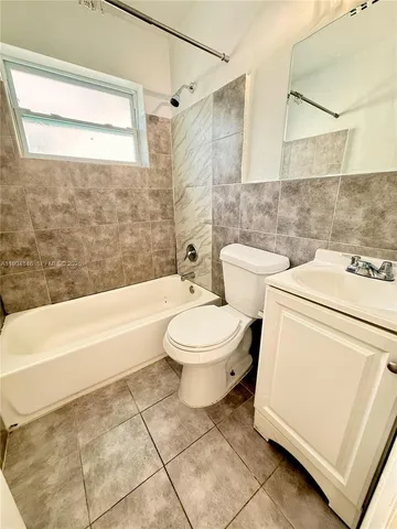 a view of house with backyard space and swimming pool