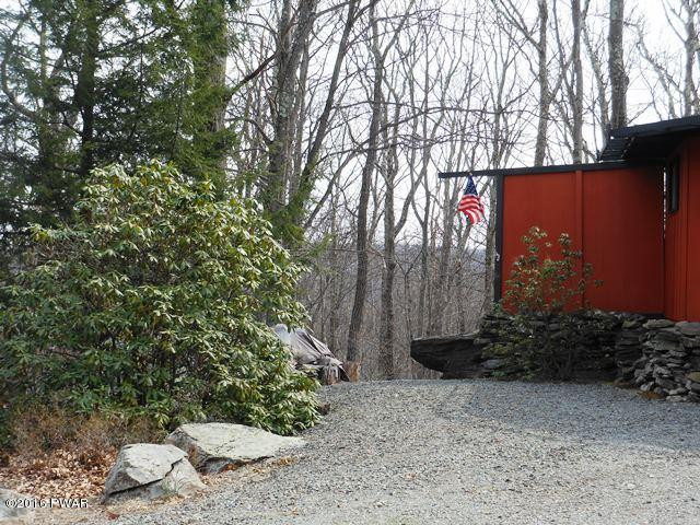 105 Ridge Road Hawley, PA 18428 - Photo 32 of 41 a view of a yard with plants and trees