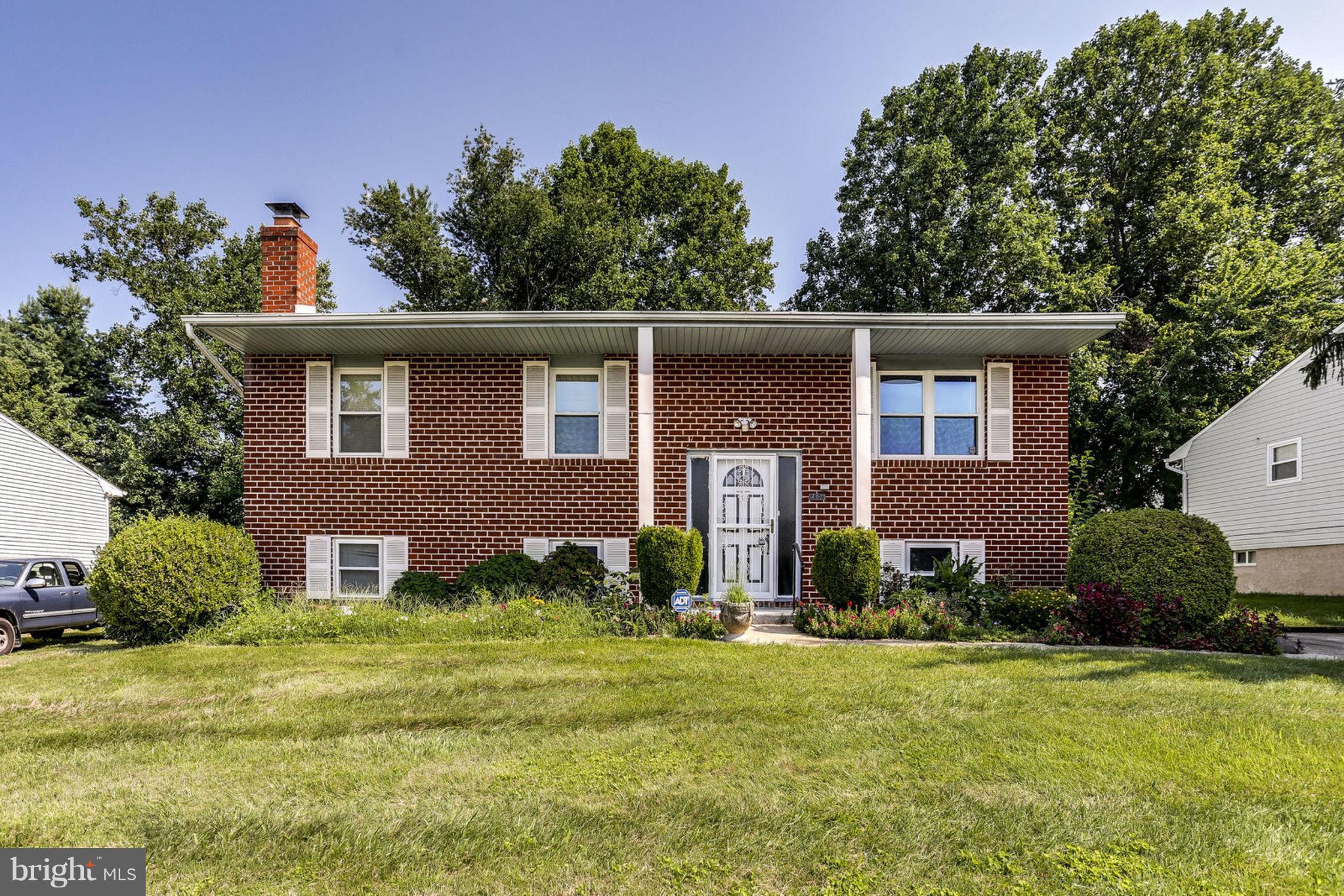 8806 Selina Road Randallstown, MD 21133 - Photo 1 of 30 a front view of a house with garden