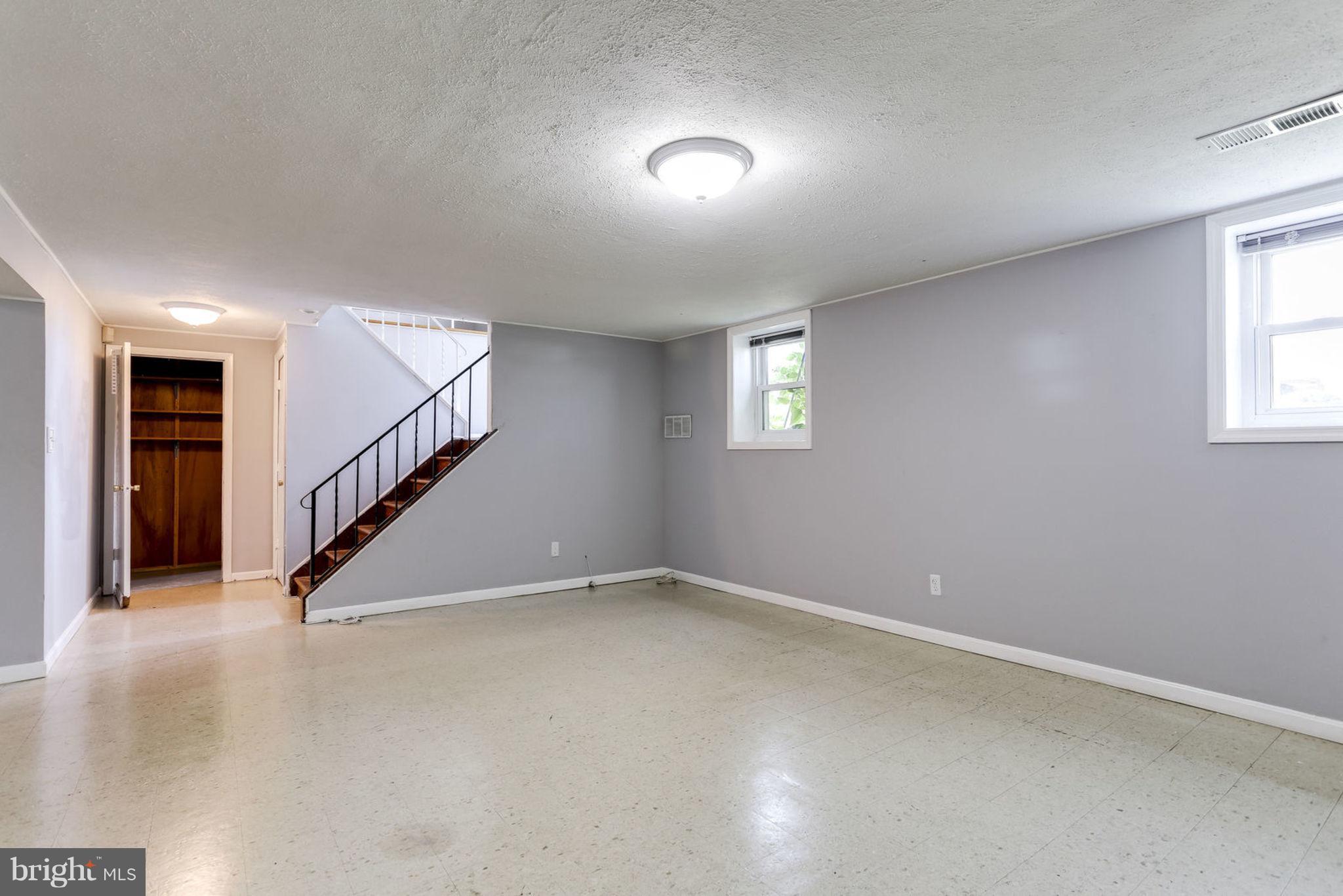 8806 Selina Road Randallstown, MD 21133 - Photo 22 of 30 a view of an empty room with stairs