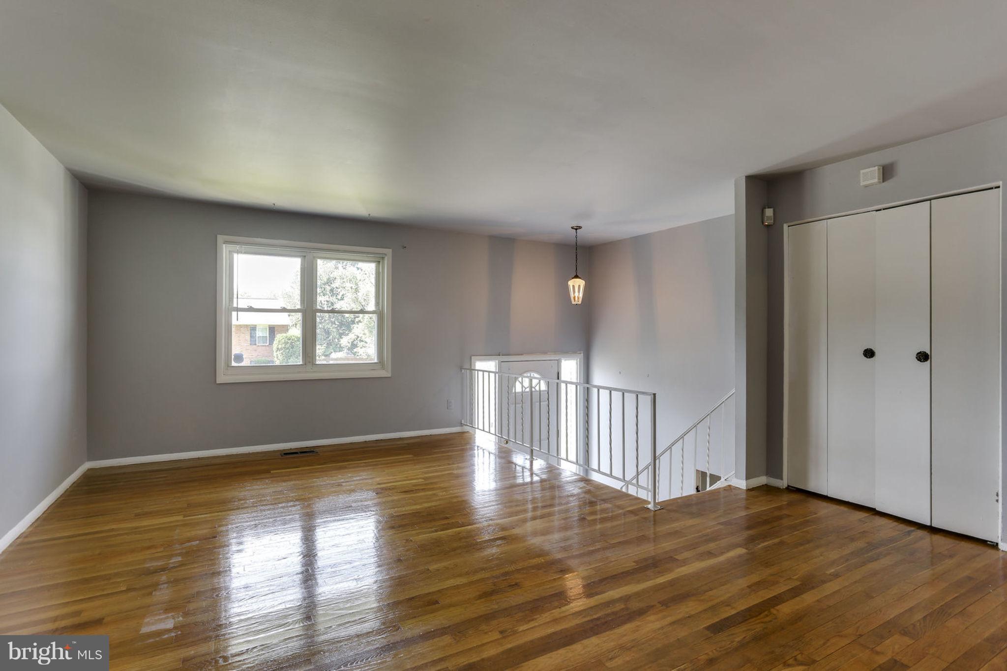 8806 Selina Road Randallstown, MD 21133 - Photo 4 of 30 a view of empty room with wooden floor