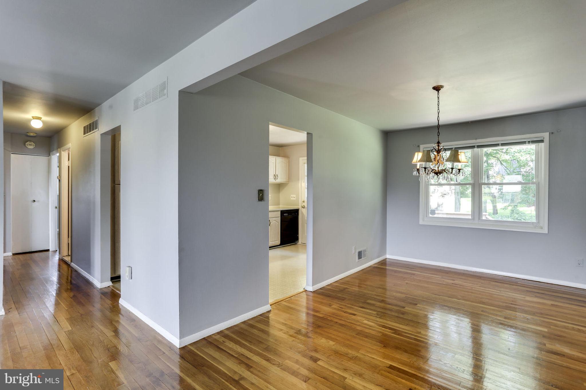 8806 Selina Road Randallstown, MD 21133 - Photo 9 of 30 an empty room with wooden floor and windows