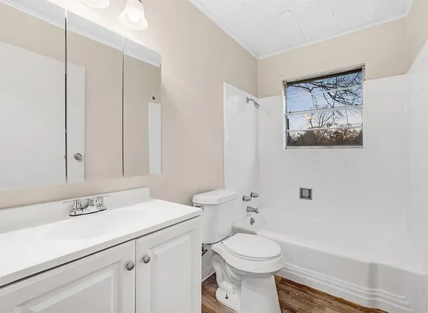 a bathroom with a sink a toilet and a bathtub