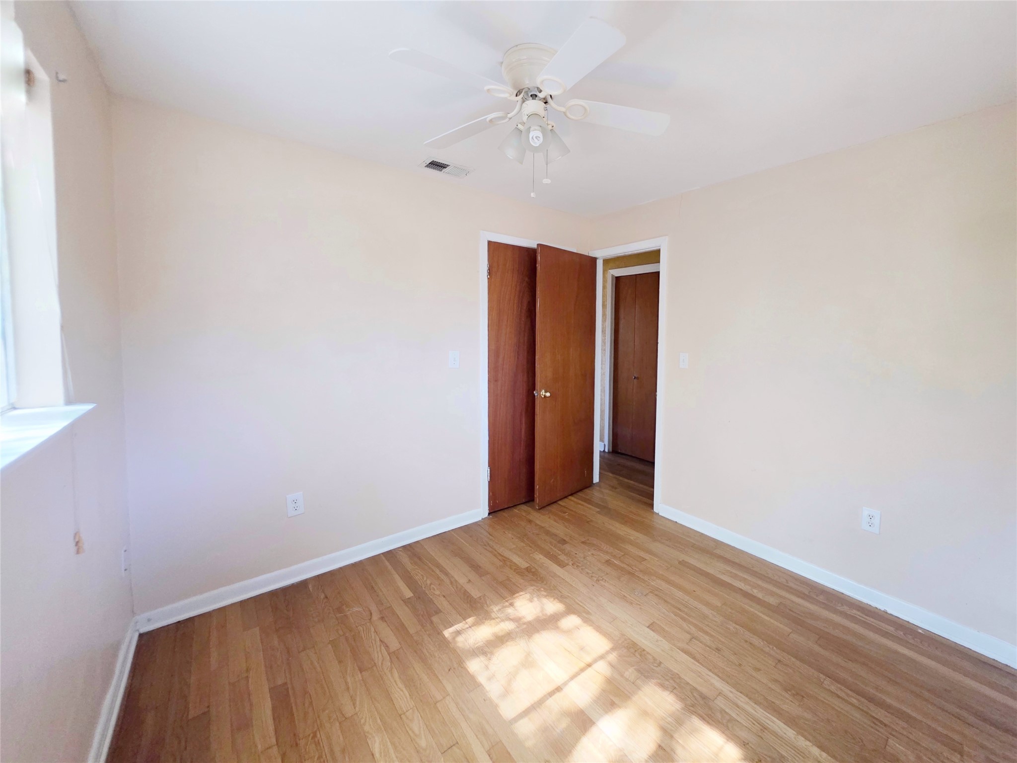 111 South Harvey House Road Somerville, TX 77879 - Photo 14 of 22 a view of an empty room with a window