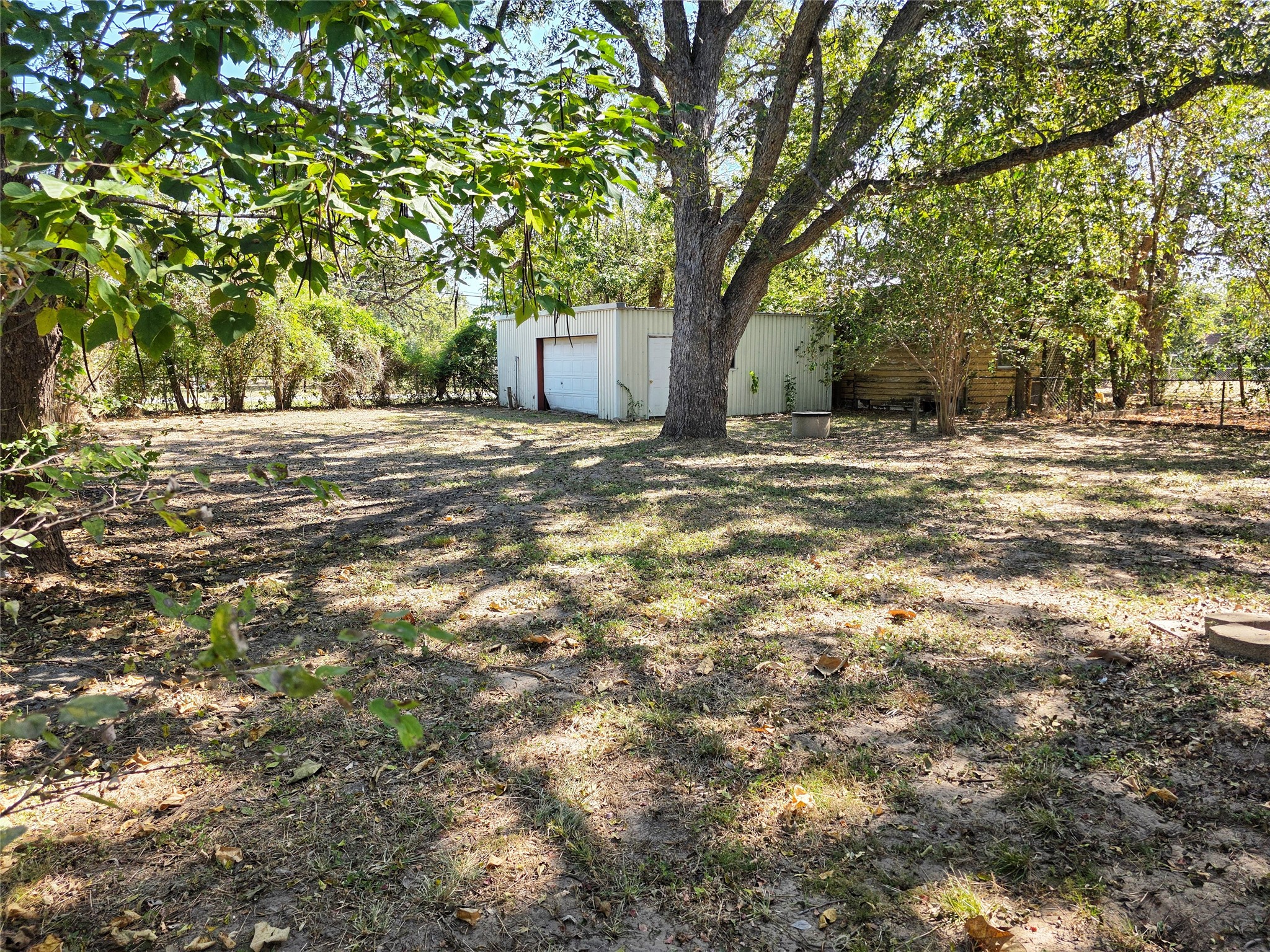 111 South Harvey House Road Somerville, TX 77879 - Photo 16 of 22 a view of a yard with plants and trees