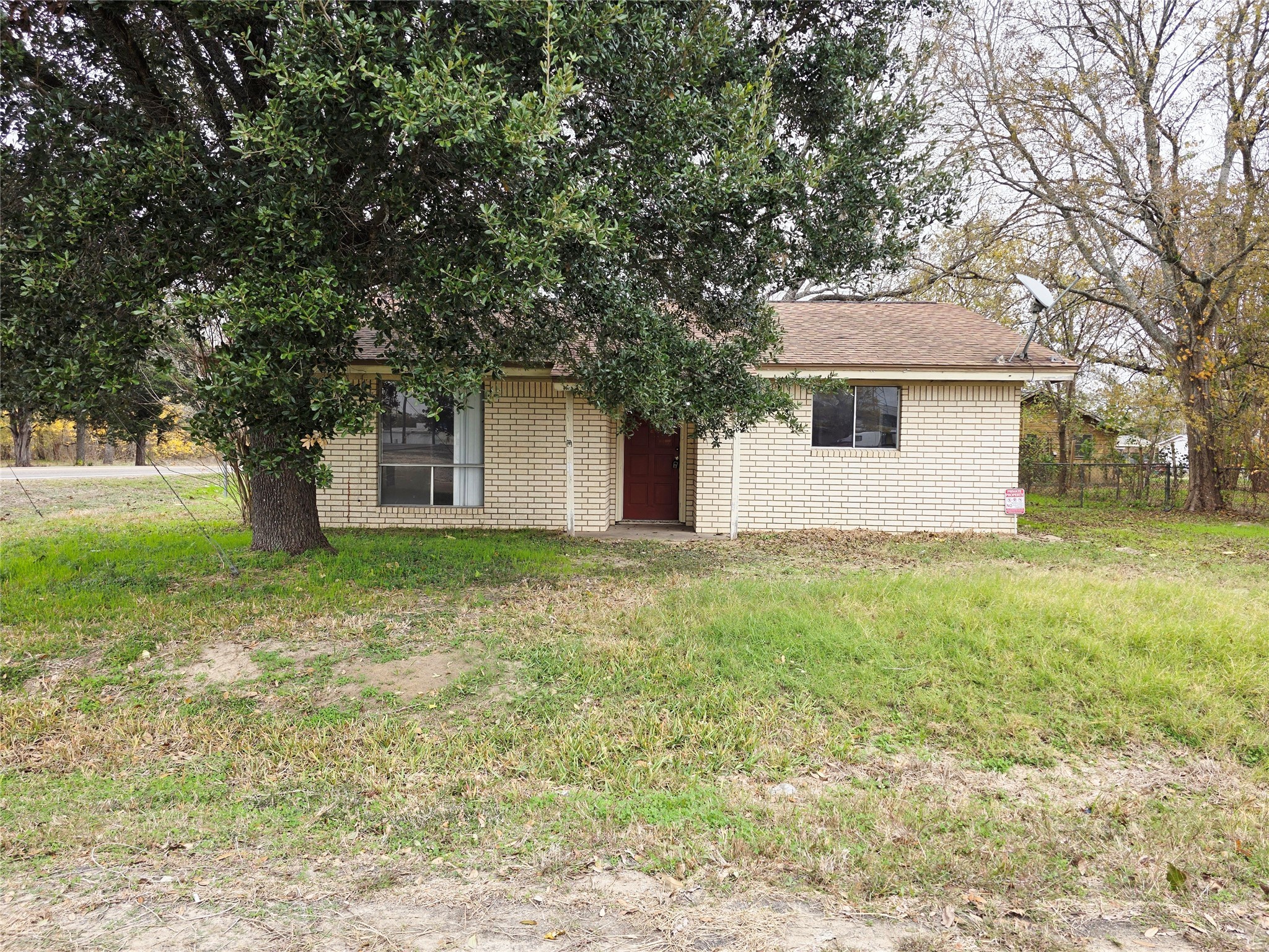 111 South Harvey House Road Somerville, TX 77879 - Photo 2 of 22 a front view of house with yard and trees