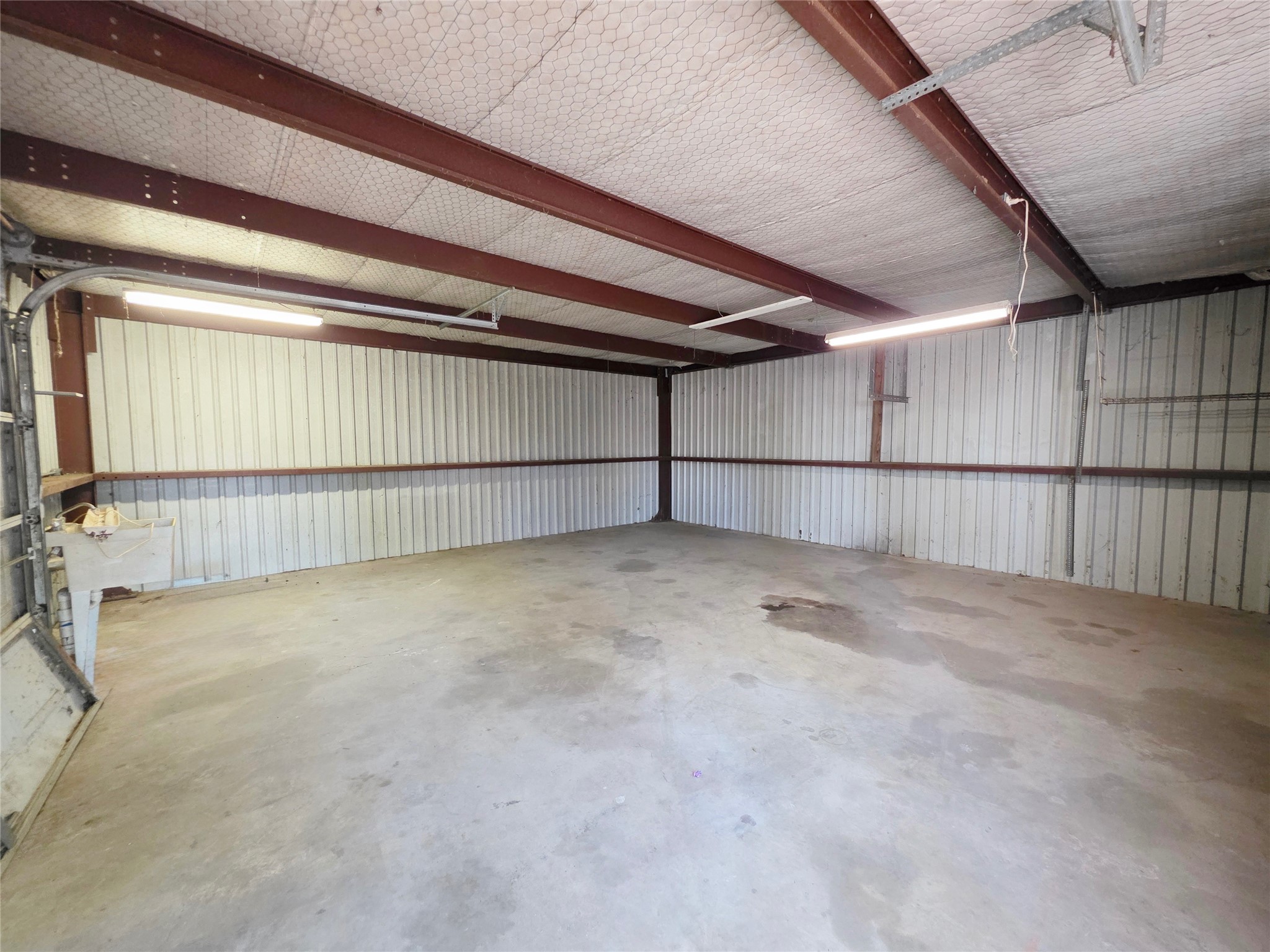 111 South Harvey House Road Somerville, TX 77879 - Photo 22 of 22 a view of a garage