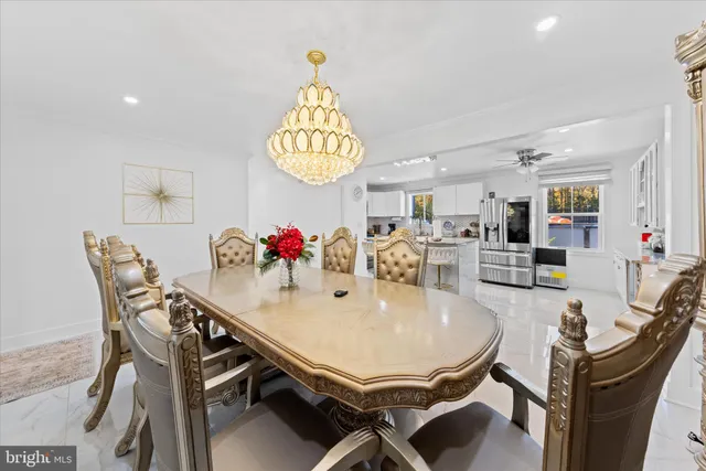 a open kitchen with stainless steel appliances granite countertop a sink stove and refrigerator