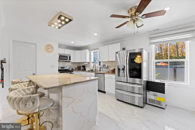 a kitchen with a sink stove and refrigerator