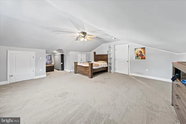 a bedroom with a bed and cabinets