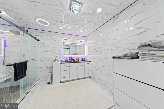 a open kitchen with stainless steel appliances granite countertop a stove and a refrigerator