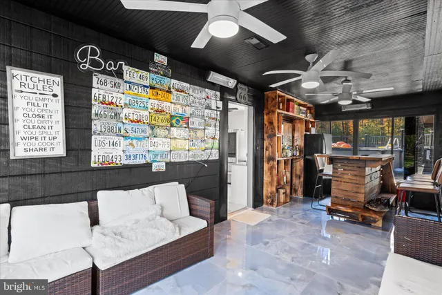 a view of a house with a yard and pathway