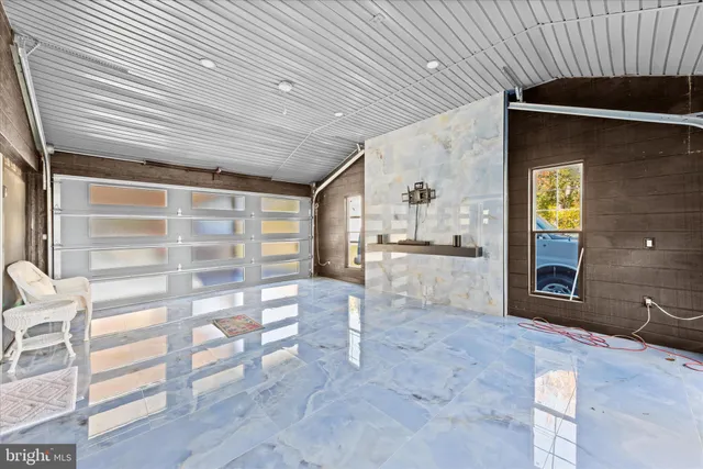 a front view of a house with a garden and yard