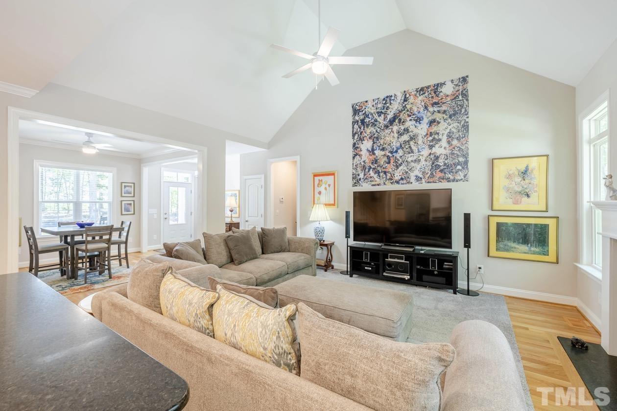 1518 Tom Oakley Road Timberlake, NC 27583 - Photo 2 of 55 a living room with furniture and a flat screen tv