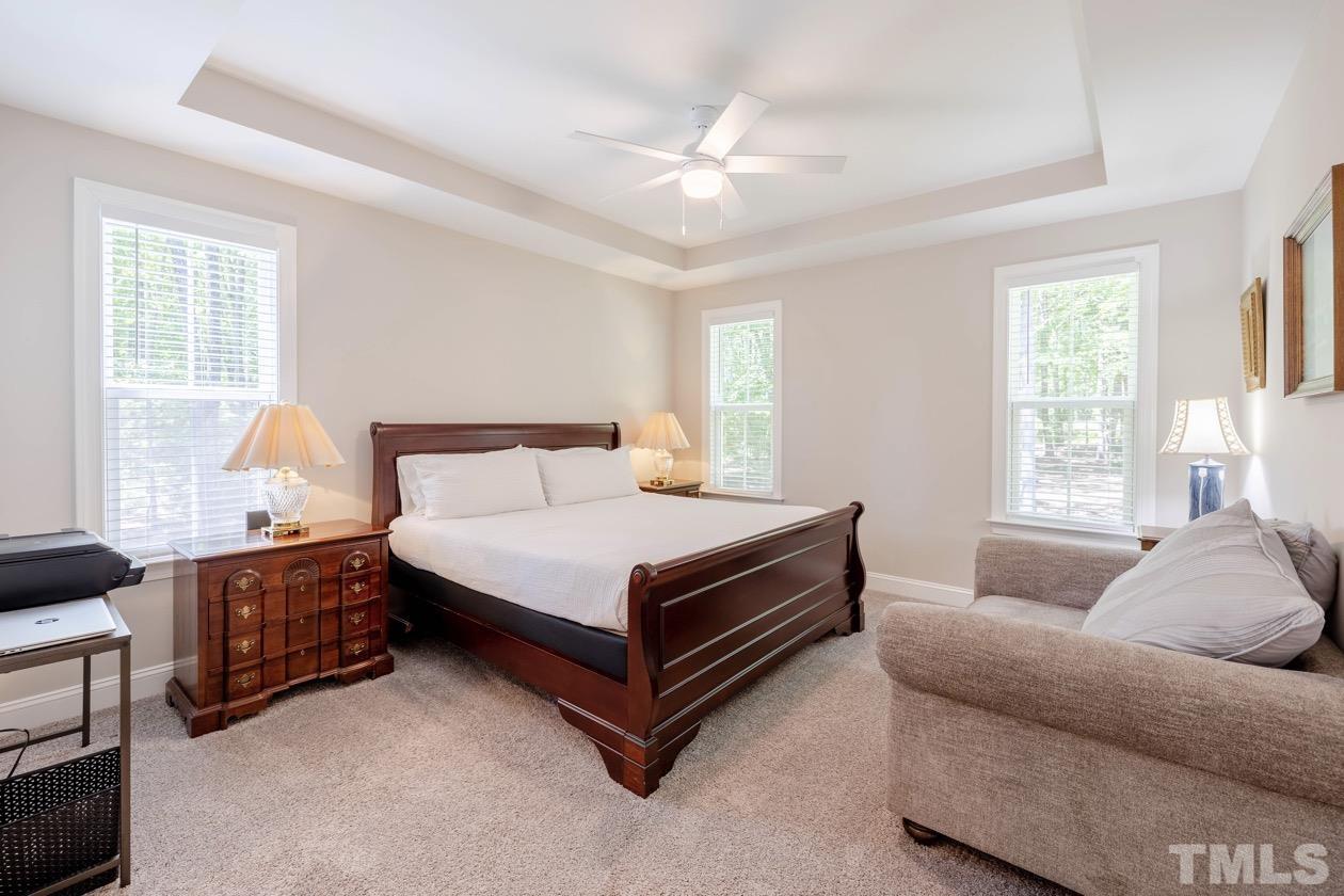 1518 Tom Oakley Road Timberlake, NC 27583 - Photo 21 of 55 a bedroom with a bed couch and window